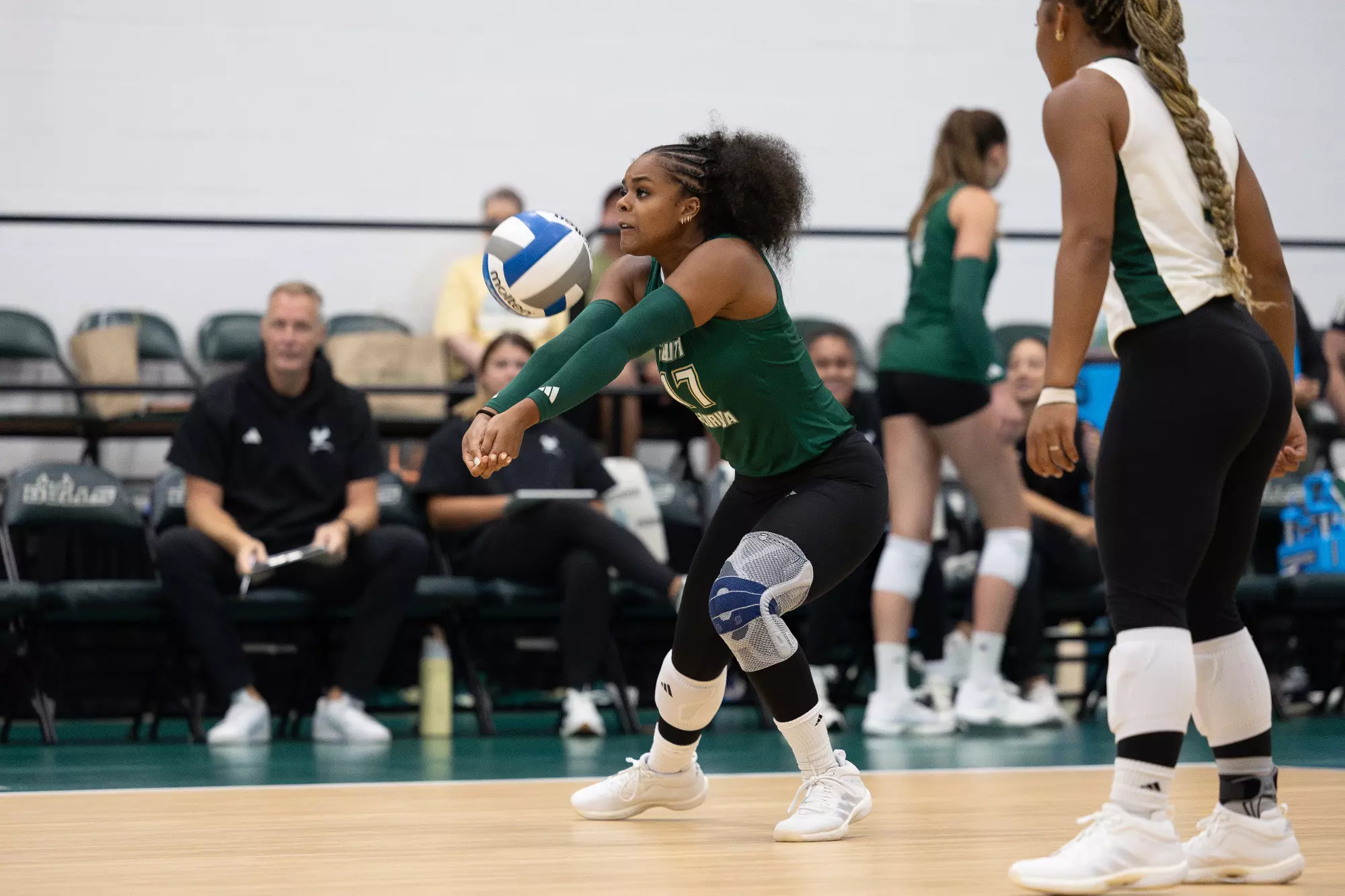 Volleyball Ryelle Rondo with a dig against Stetson