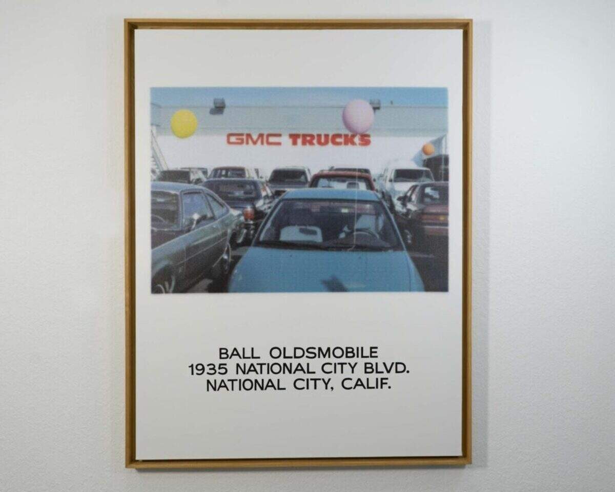John Baldessari, “Ball Oldsmobile, 1935 National City Blvd., National City, Calif.,” 1996, Ink-jet and enamel paint on canvas 149.9 x 114.9 cm, 59 x 45 1/4 inches. Craig Robins Collection, Miami. © 1996 -2026 John Baldessari Family Foundation