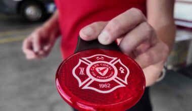 Florida firefighters provide backpack reflectors for bus stop
