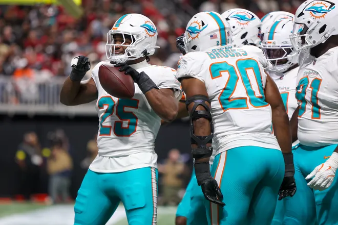 Oct 26, 2025; Atlanta, Georgia, USA; Miami Dolphins linebacker Tyrel Dodson (25) celebrates with teammates after a fumble recovery against the Atlanta Falcons in the third quarter at Mercedes-Benz Stadium. Mandatory Credit: Brett Davis-Imagn Images