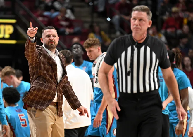 Feb 24, 2026; Tallahassee, Florida, USA; Florida State Seminoles head coach Luke Loucks exchanges words with a referee during the first half against the Miami Hurricanes at Donald L. Tucker Center. Mandatory Credit: Melina Myers-Imagn Images