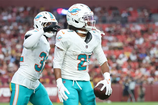 Aug 14, 2026; Landover, Maryland, USA; Miami Dolphins cornerback Marco Wilson (21) celebrates after intercepting a pass during the first half against the Washington Commanders at Northwest Stadium. Mandatory Credit: Amber Searls-Imagn Images