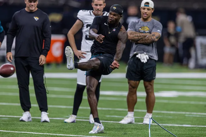 Aug 15, 2026; New Orleans, Louisiana, USA; Jacksonville Jaguars wide receiver Travis Hunter (12) misses a field goal with place kicker Cam Little (39) against the New Orleans Saints at Caesars Superdome. Mandatory Credit: Stephen Lew-Imagn Images