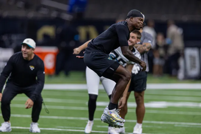 Aug 15, 2026; New Orleans, Louisiana, USA; Jacksonville Jaguars wide receiver Travis Hunter (12) reacts to missing a field goal with place kicker Cam Little (39) against the New Orleans Saints at Caesars Superdome. Mandatory Credit: Stephen Lew-Imagn Images