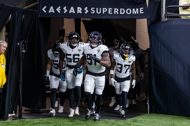 Aug 15, 2026; New Orleans, Louisiana, USA; Jacksonville Jaguars linebacker Ventrell Miller (51) and linebacker Yasir Abdullah (56) and cornerback Jabbar Muhammad (37) run out the tunnel against the New Orleans Saints at Caesars Superdome. Mandatory Credit: Stephen Lew-Imagn Images