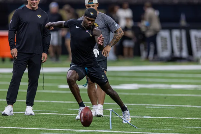 Aug 15, 2026; New Orleans, Louisiana, USA; Jacksonville Jaguars wide receiver Travis Hunter (12) misses a field goal with place kicker Cam Little (39) against the New Orleans Saints at Caesars Superdome. Mandatory Credit: Stephen Lew-Imagn Images