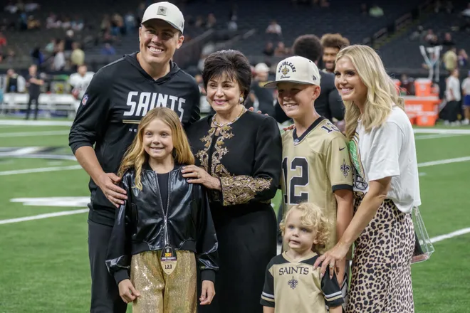 Aug 15, 2026; New Orleans, Louisiana, USA; New Orleans Saints head coach Kellen Moore takes a photo with his family and New Orleans Saints owner Gayle Benson, center, at Caesars Superdome. Mandatory Credit: Matthew Hinton-Imagn Images