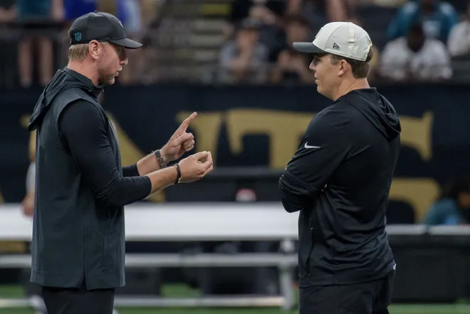 Aug 15, 2026; New Orleans, Louisiana, USA; Jacksonville Jaguars head coach Liam Coen, left, talks to New Orleans Saints head coach Kellen Moore before a game at Caesars Superdome. Mandatory Credit: Matthew Hinton-Imagn Images