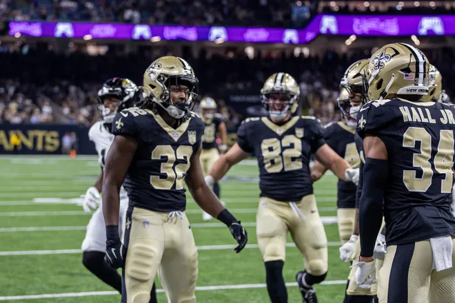 Aug 15, 2026; New Orleans, Louisiana, USA; New Orleans Saints running back Ty Chandler (32) runs the opening kickoff and is tackled by Jacksonville Jaguars safety Jalen Huskey (22) during the first half at Caesars Superdome. Mandatory Credit: Stephen Lew-Imagn Images