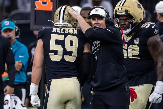 Aug 15, 2026; New Orleans, Louisiana, USA; New Orleans Saints defensive edge Garrett Nelson (59) is congratulated by New Orleans Saints head coach Kellen Moore after a sack against Jacksonville Jaguars quarterback Nick Mullens (14) during the first half at Caesars Superdome. Mandatory Credit: Stephen Lew-Imagn Images