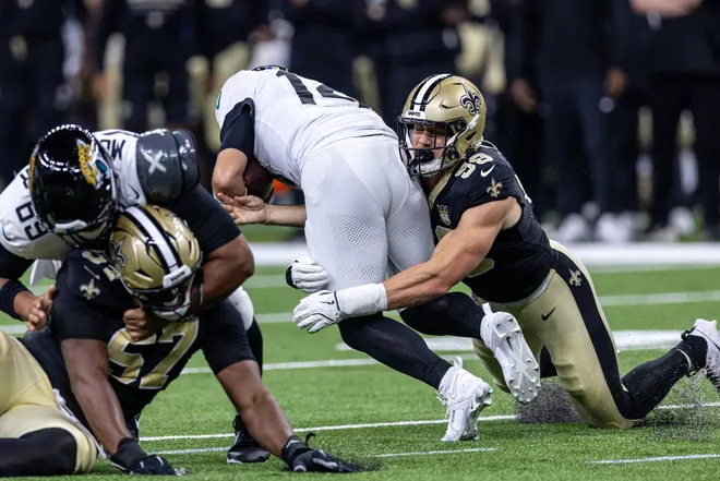 Aug 15, 2026; New Orleans, Louisiana, USA; New Orleans Saints defensive edge Garrett Nelson (59) sacks Jacksonville Jaguars quarterback Nick Mullens (14) during the first half at Caesars Superdome. Mandatory Credit: Stephen Lew-Imagn Images