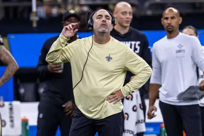Aug 15, 2026; New Orleans, Louisiana, USA; New Orleans Saints special team coordinator Phil Galiano listens to who a penalty was called on against the Jacksonville Jaguars during the first half at Caesars Superdome. Mandatory Credit: Stephen Lew-Imagn Images