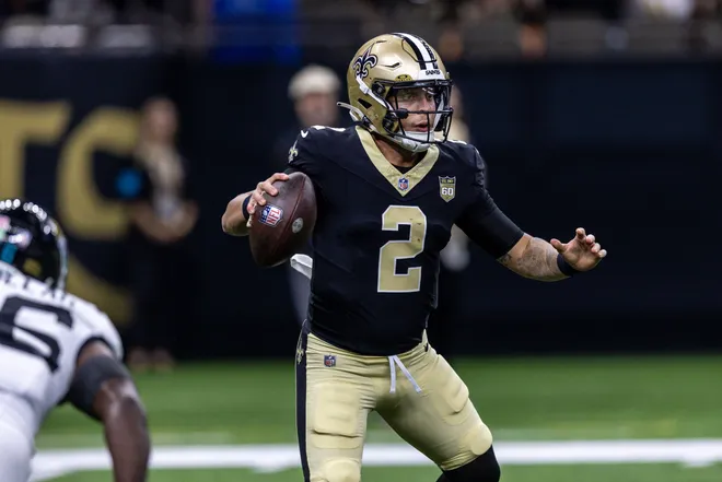 Aug 15, 2026; New Orleans, Louisiana, USA; New Orleans Saints quarterback Spencer Rattler (2) scrambles from the pocket and fumbles the ball against Jacksonville Jaguars linebacker Yasir Abdullah (56) during the first half at Caesars Superdome. Mandatory Credit: Stephen Lew-Imagn Images