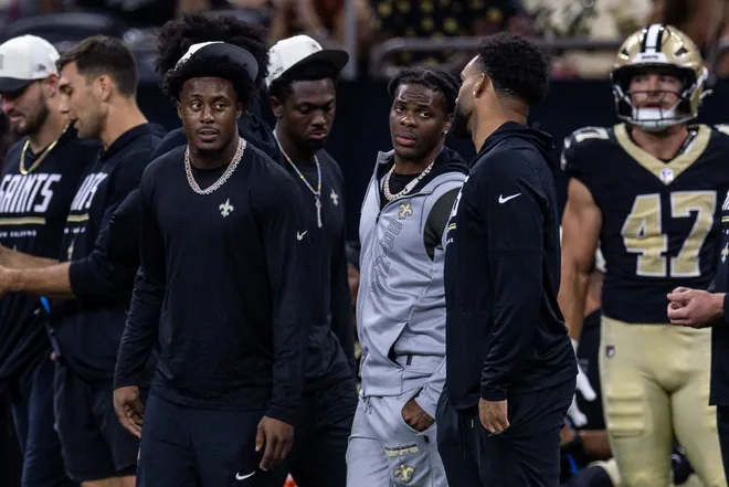 Aug 15, 2026; New Orleans, Louisiana, USA; New Orleans Saints cornerback Kool-Aid McKinstry (1) (left) talks to wide receiver Chris Olave (12) (right) against Jacksonville Jaguars during the first half at Caesars Superdome. Mandatory Credit: Stephen Lew-Imagn Images