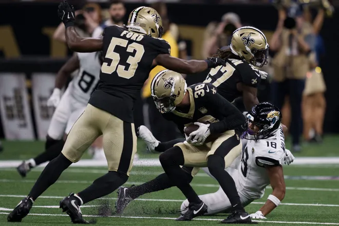 Aug 15, 2026; New Orleans, Louisiana, USA; New Orleans Saints defensive back Jayden Price (38) makes an interception against Jacksonville Jaguars wide receiver C.J. Williams (18) during the second quarter at Caesars Superdome. Mandatory Credit: Matthew Hinton-Imagn Images