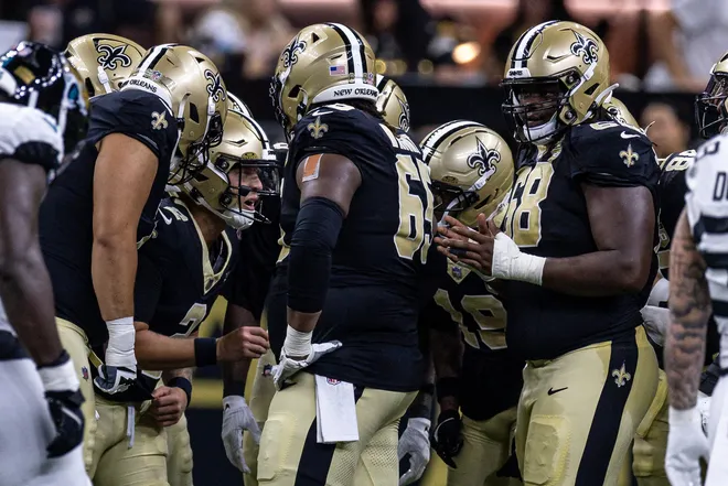 Aug 15, 2026; New Orleans, Louisiana, USA; New Orleans Saints quarterback Spencer Rattler (2) calls a play in the huddle against Jacksonville Jaguars during the first half at Caesars Superdome. Mandatory Credit: Stephen Lew-Imagn Images