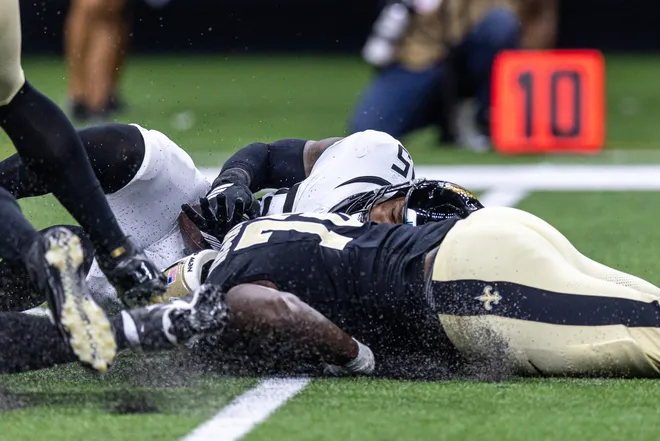Aug 15, 2026; New Orleans, Louisiana, USA; Jacksonville Jaguars defensive end B.J. Green II (95) recovers a fumble by New Orleans Saints quarterback Spencer Rattler (2) during the first half at Caesars Superdome. Mandatory Credit: Stephen Lew-Imagn Images