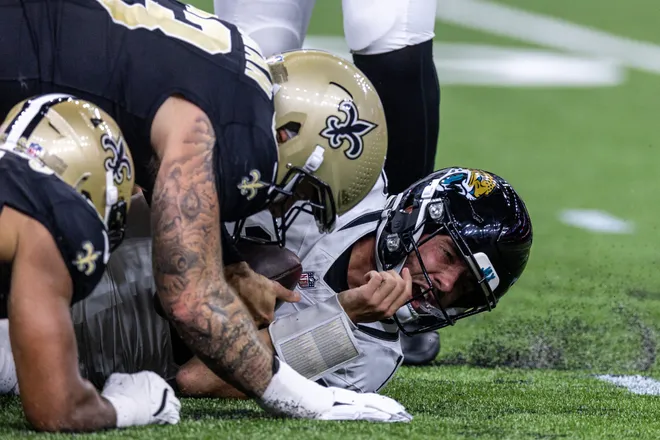 Aug 15, 2026; New Orleans, Louisiana, USA; Jacksonville Jaguars quarterback Carter Bradley (10) is sacked by Jacksonville Jaguars linebacker Parker Hughes (53) during the first half at Caesars Superdome. Mandatory Credit: Stephen Lew-Imagn Images
