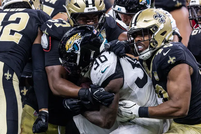 Aug 15, 2026; New Orleans, Louisiana, USA; Jacksonville Jaguars running back J'mari Taylor (30) is tackled by New Orleans Saints cornerback Mike Reid (42) during the second half at Caesars Superdome. Mandatory Credit: Stephen Lew-Imagn Images