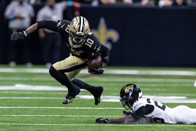 Aug 15, 2026; New Orleans, Louisiana, USA; New Orleans Saints wide receiver Trey Palmer (10) leaps over a tackle against Jacksonville Jaguars during the second half at Caesars Superdome. Mandatory Credit: Stephen Lew-Imagn Images