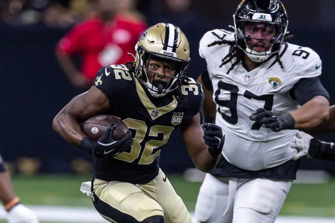 Aug 15, 2026; New Orleans, Louisiana, USA; New Orleans Saints running back Ty Chandler (32) runs against Jacksonville Jaguars defensive tackle Keivie Rose (97) during the second half at Caesars Superdome. Mandatory Credit: Stephen Lew-Imagn Images