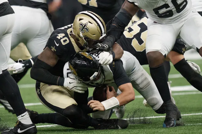Aug 15, 2026; New Orleans, Louisiana, USA; New Orleans Saints linebacker Fadil Diggs (40) sacks Jacksonville Jaguars quarterback Carter Bradley (10) during the second half at Caesars Superdome. Mandatory Credit: Matthew Hinton-Imagn Images