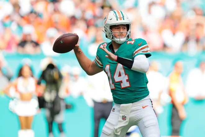 Dec 21, 2025; Miami Gardens, Florida, USA; Miami Dolphins quarterback Quinn Ewers (14) drops back for a pass during the first quarter at Hard Rock Stadium. Mandatory Credit: Sam Navarro-Imagn Images