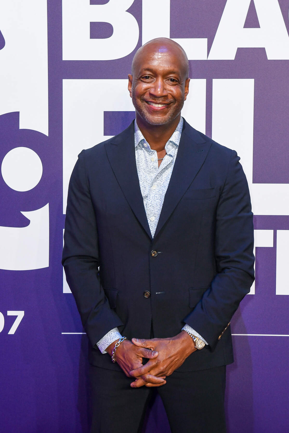American Black Film Festival founder Jeff Friday poses on the red carpet for opening night of the festival.