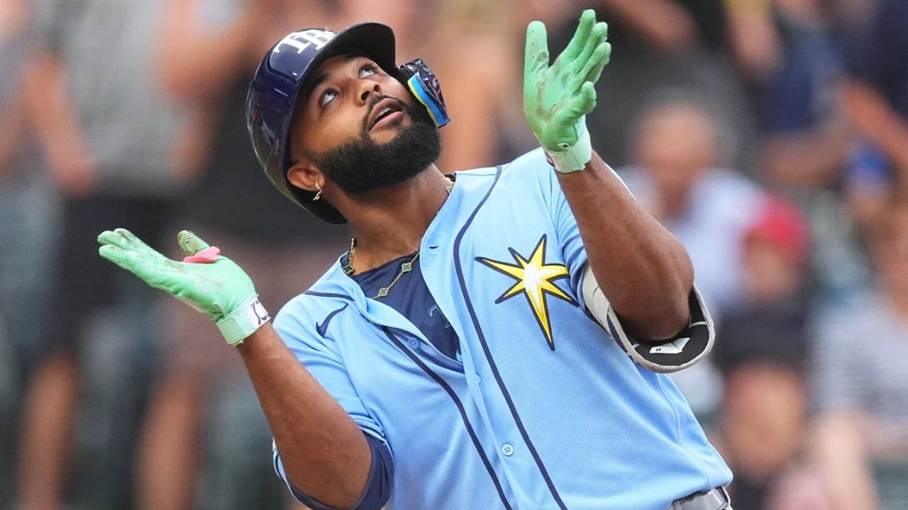 Tampa Bay's Junior Caminero celebrates as he crosses home plate after hitting a 2-run homer against the Colorado Rockies in the first inning Monday afternoon in Denver. (AP Photo/David Zalubowski)