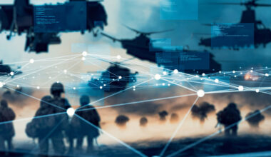 Soldiers and military aircraft overlaid with digital code and network connections representing defense technology.