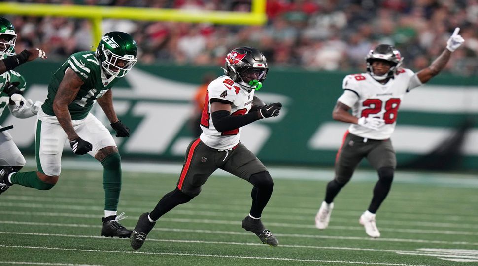 Tampa Bay Buccaneers cornerback Ayden Garnes (24) runs from New York Jets wide receiver Tim Patrick (17) while returning an interception for a touchdown during the first half of a preseason NFL football game, Friday, Aug. 14, 2026, in East Rutherford, N.J. (AP Photo/Frank Franklin II)