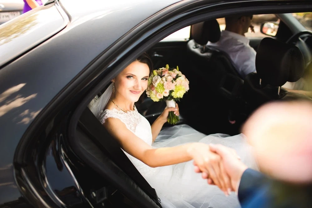 Bride exiting limo