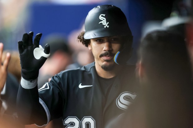 White Sox third baseman Miguel Vargas high-fives teammates in the dugout after hitting a solo home run against the Rays in the first inning Friday, July 31, 2026, in St. Petersburg, Fla. (Mike Carlson/Getty)