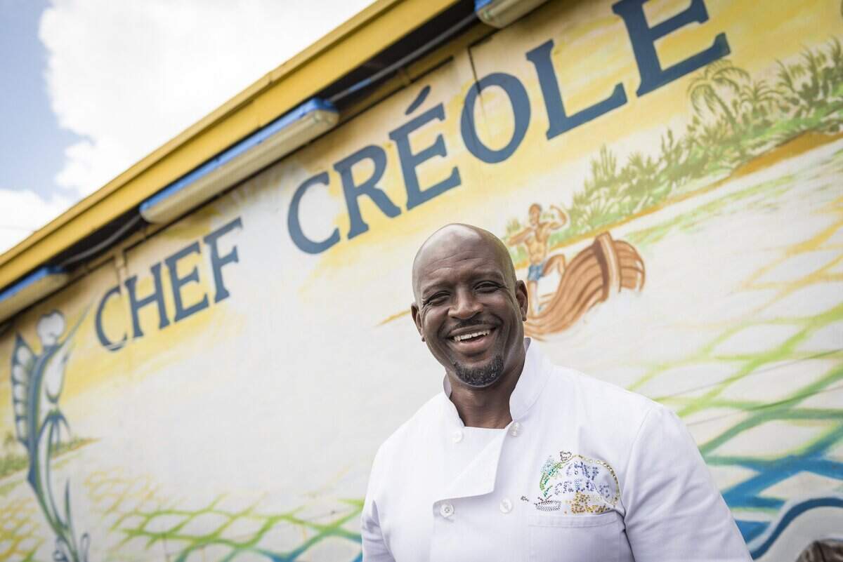 Wilkinson Sejour poses for a portrait in front of his Little Haiti restaurant in 2018.
