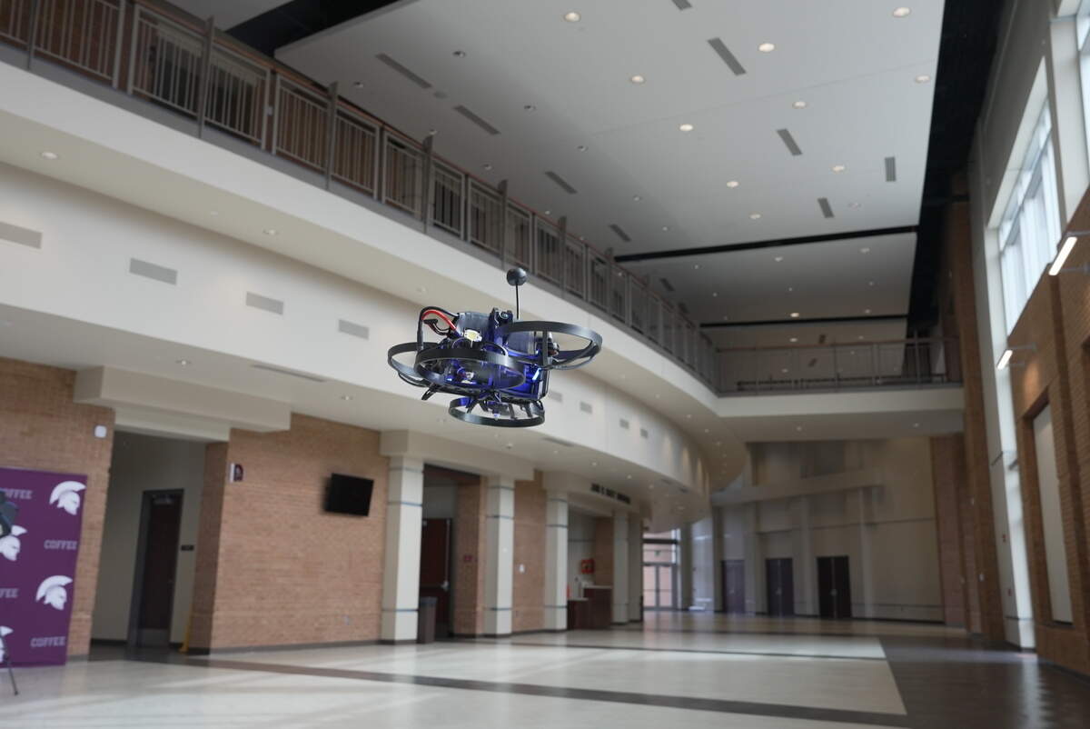 A Campus Guardian Angel drone flies through a high school as part of a demonstration. The drones are designed to respond to school shooters with pepper spray, flashing lights and loud noise. Some school districts in Florida, including Broward, are participating in a pilot program that will install the drones into schools.