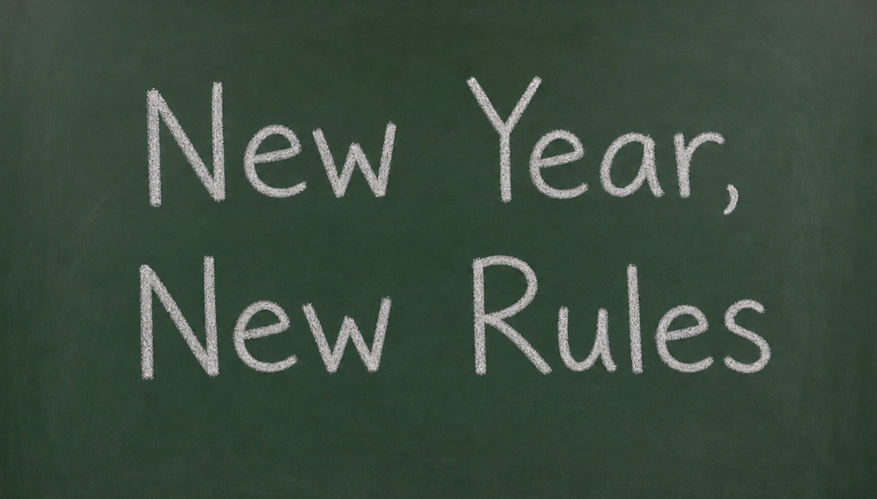 chalkboard with "New Year, New Rules" written on it