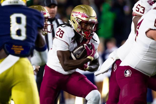 Florida State running back Samuel Singleton Jr. (28) runs the ball during the first half of an NCAA college football game against Notre Dame Saturday, Nov. 9, 2024, in South Bend, Ind. (AP Photo/Michael Caterina)