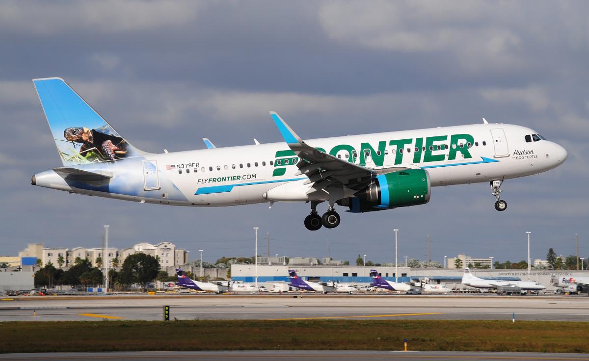 A Frontier airlines plane in flight.
