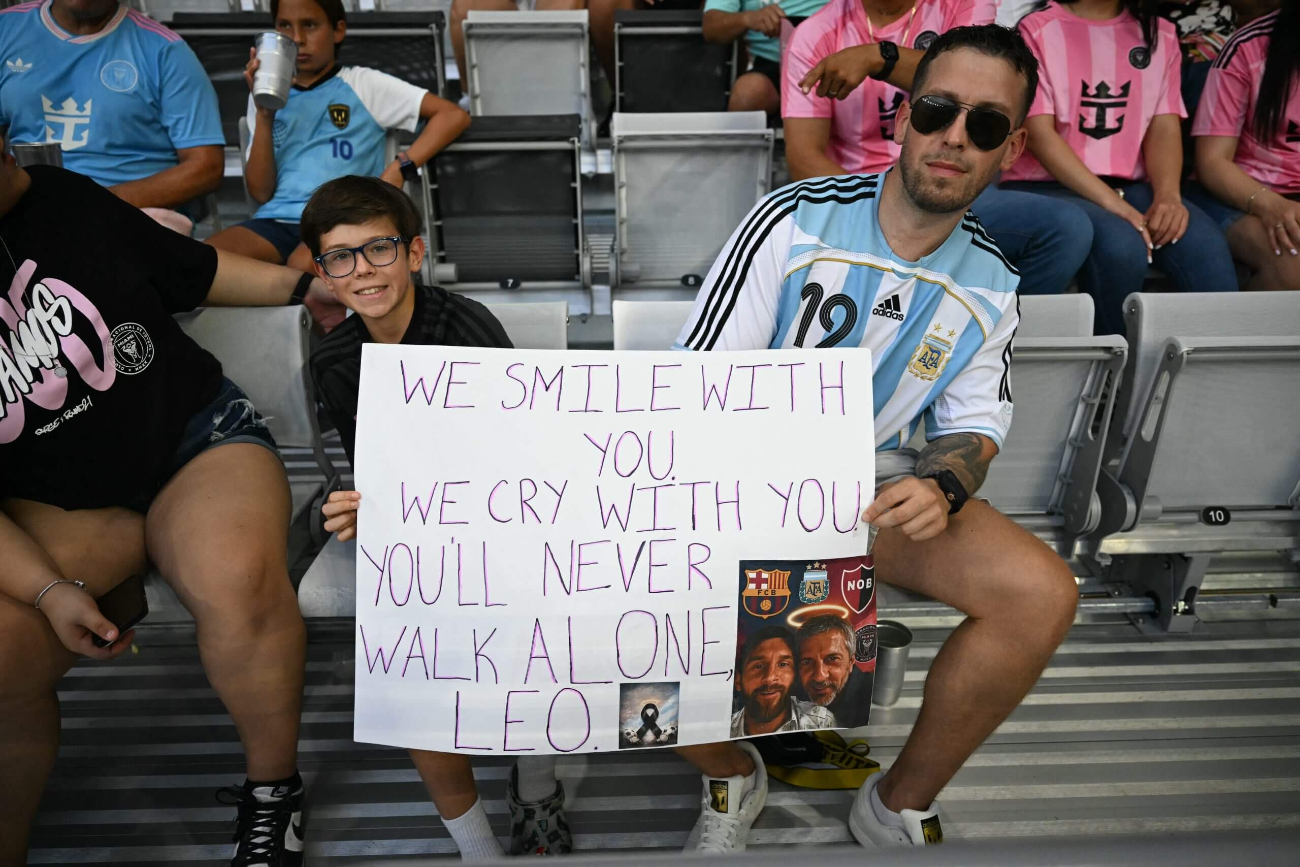 Messi fans hold a sign of support