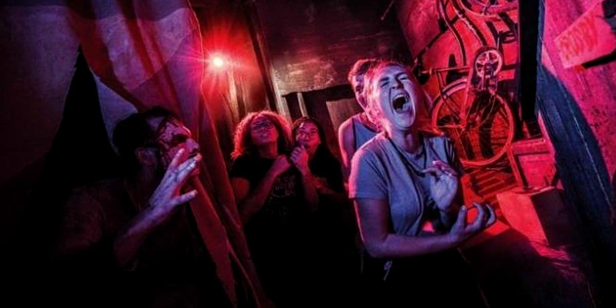 Guests screaming while attending Halloween Horror Nights