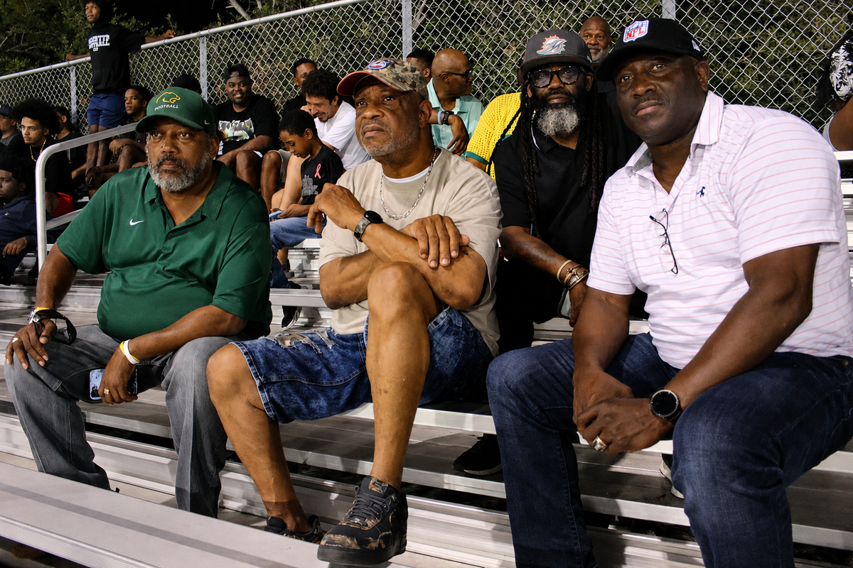 Mel Graham, Wayne White, Jerry Junious and Randal Hill watch a football game between their alma mater, Miami Killian Senior High and Miami Southridge Senior High Aug. 14.