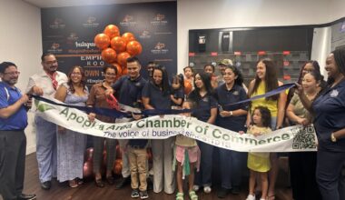 Representatives of Empire Pros Roofing, the Apopka Area Chamber of Commerce and community members gather for a recent Chamber ribbon-cutting ceremony at the business. The Chamber is working to expand events and increase engagement with member businesses as it rebuilds following a leadership dispute last year.