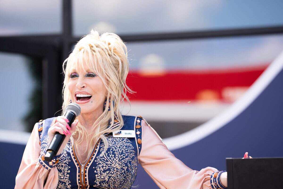 Dolly Parton speaks to the crowd during the grand opening of Dolly's Tennessean Travel Stop in Cornersville on June 24, 2026.