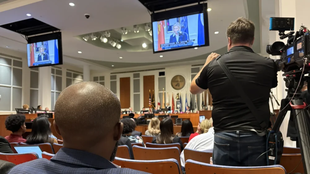 Audience members watch during a Jacksonville budget session