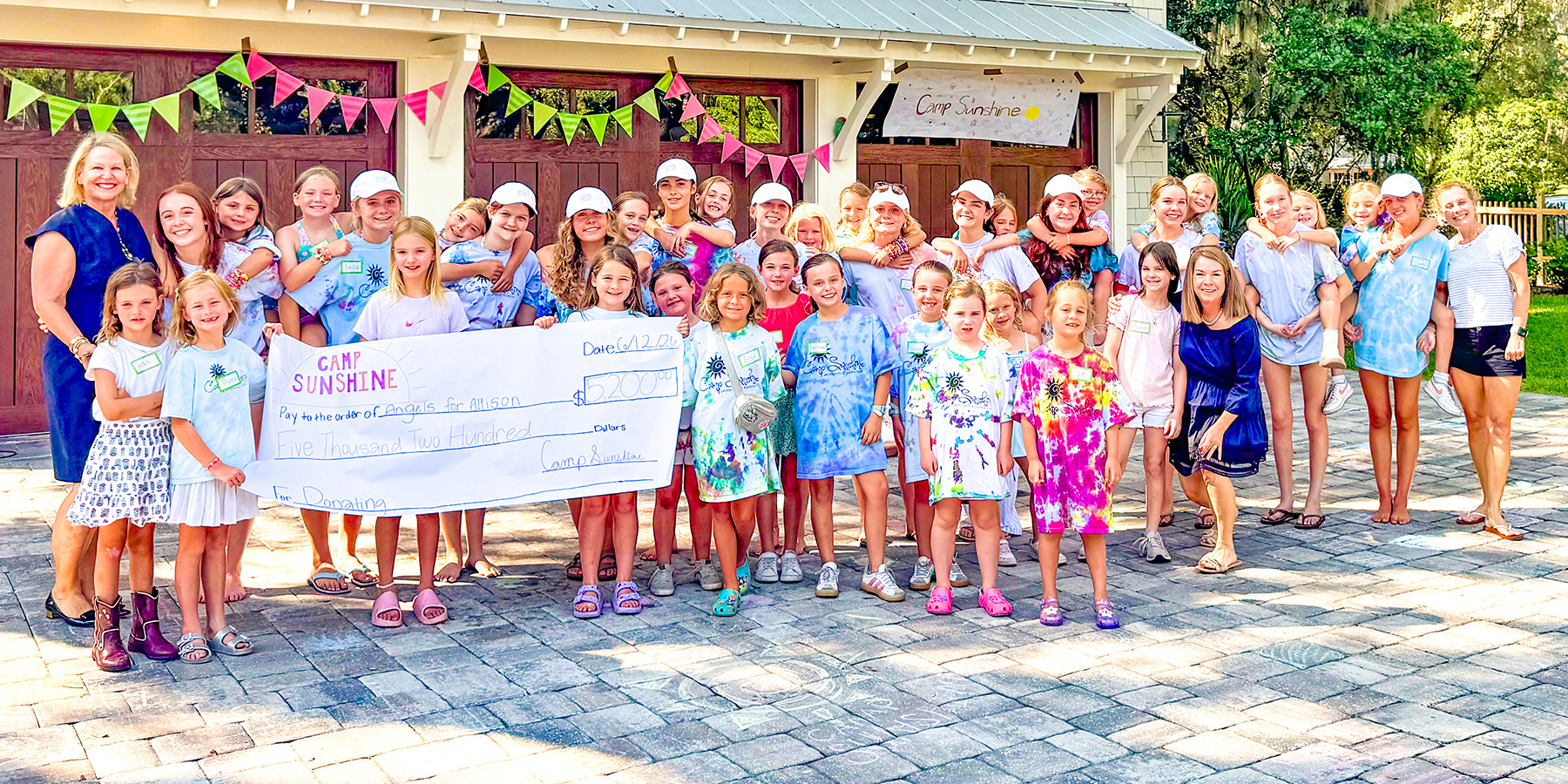 Camp Sunshine counselors and campers with Board President Drew Haramis