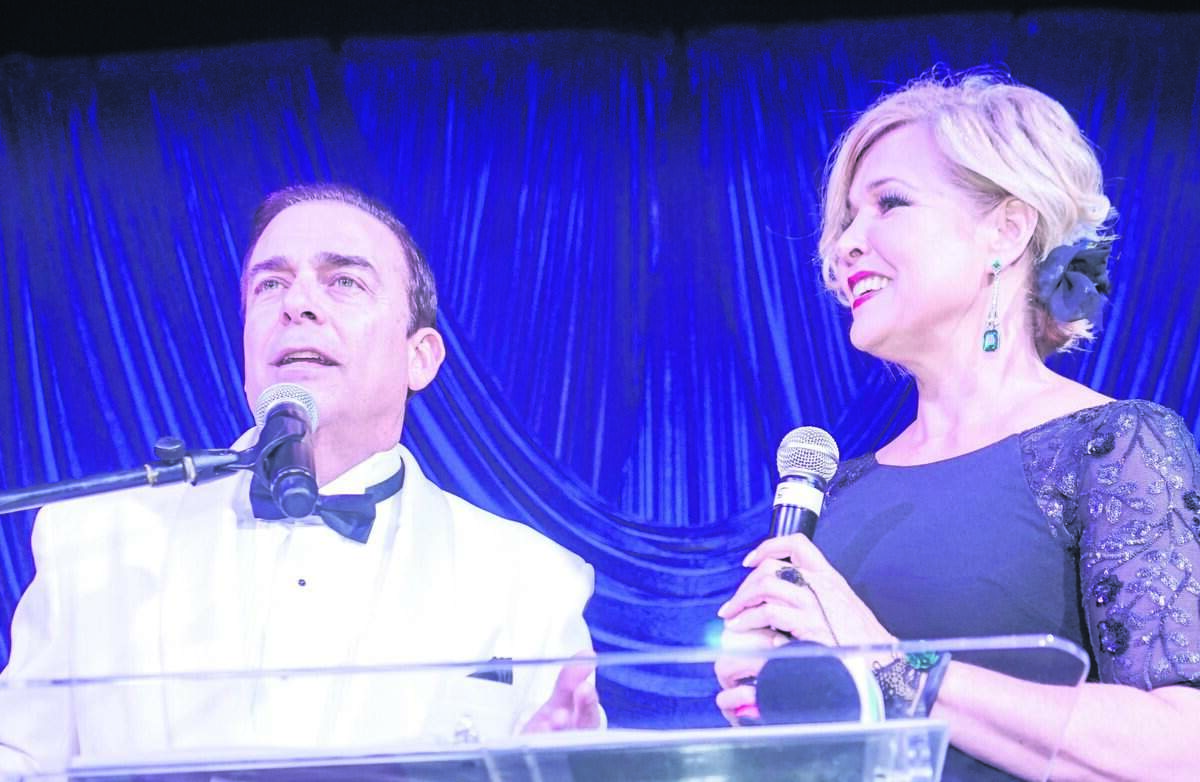 Anchors Ambrosio Hernández and Sandra Peebles serve as masters of ceremonies at an event in Miami in 2019.