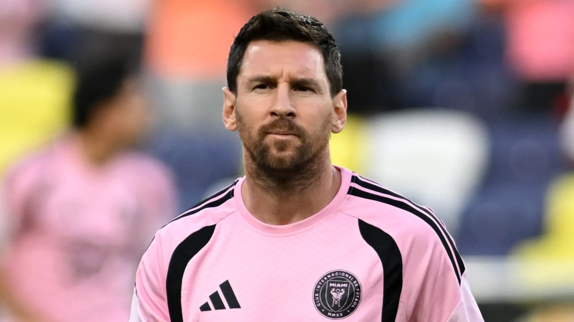 Lionel Messi looks on