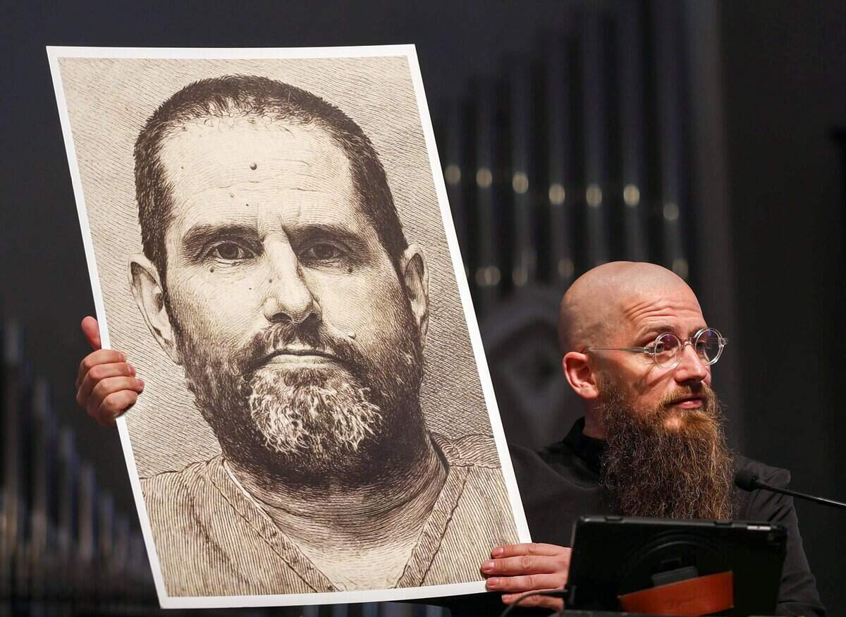Resident theologian Rev. Jeff Hood, the spiritual advisor who has dedicated his pastoral career to counseling inmates on death row, holds a picture of William Silvia, who is set to be executed on August 18 during Sunday service at Sunshine Cathedral on August 17, 2026, in Fort Lauderdale, Florida. Hood, who has clients all over the country, has been busier than usual this year - particularly with inmates in Florida, a state that has reached record-breaking execution numbers under Gov. Ron DeSantis.