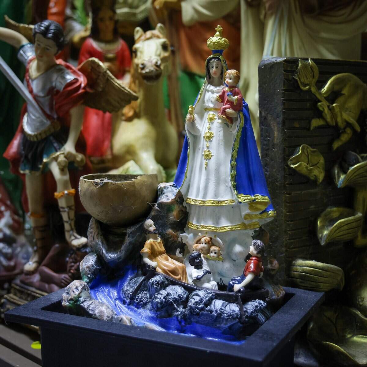 Universal Santeria priest Hector Giovanni Pizarro, known as “Oba Ti Lemi” to practitioners, sells religious figurines such as the Virgen de la Caridad del Cobre and other artifacts in his consultation room as he faces rising rent and the aftermath of a water-damaged storefront in Fort Lauderdale, Monday, July 20, 2026.