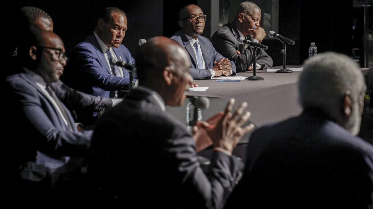 Miami-Dade Commissioner Oliver Gilbert, center, answers his question from moderators as other candidates listen during the debate at the Little Haiti Cultural Complex, Candidates for Florida's 24th Congressional District, including entrepreneur Te Mayonna Brown, arts director Marshall Davis, Miami-Dade Commissioner Oliver Gilbert, state Sen. Shevrin Jones, Kendrick Meek Jr., former commissioner Jean Monestime, physician Rudolph Moise and attorney Roderick Vereen, participate in a debate at the Little Haiti Cultural Complex, Monday, July 13, 2026, in Miami. The event was hosted by the Miami Herald, WLRN, NBC 6 and MIA Media Group, with questions from moderators Jawan Strader of NBC 6 and Amy Driscoll of the Miami Herald.